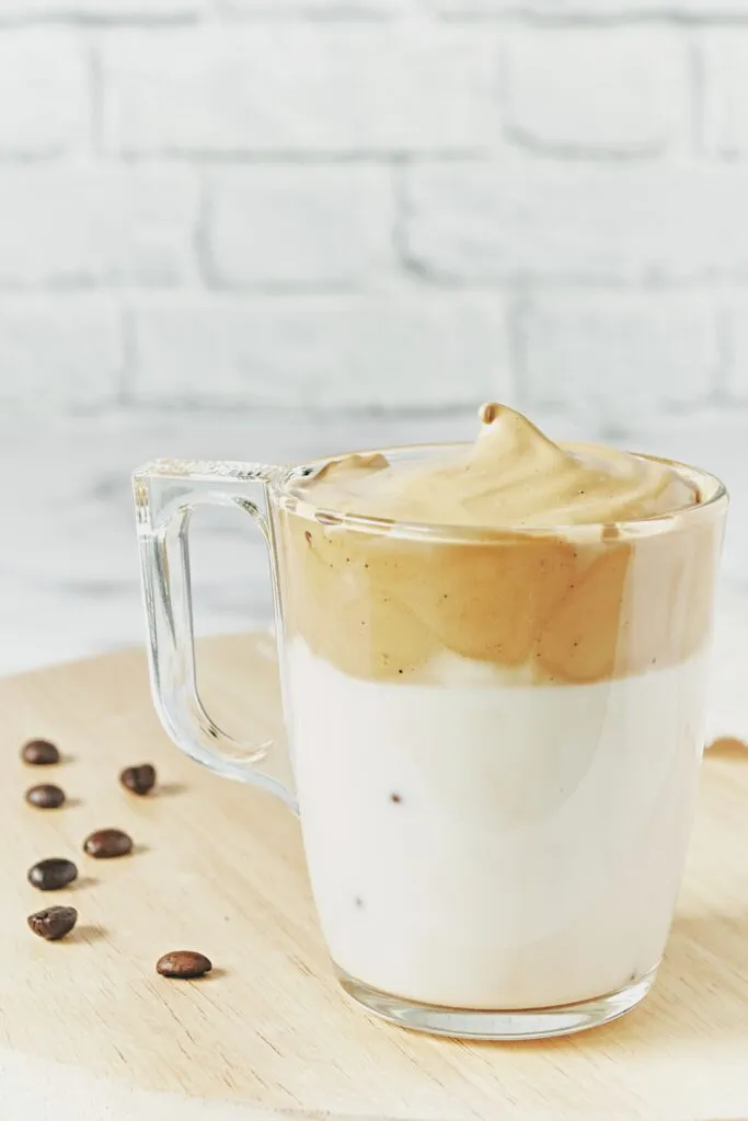 closeup shot iced dalgona whipped coffee with fluffy creamy