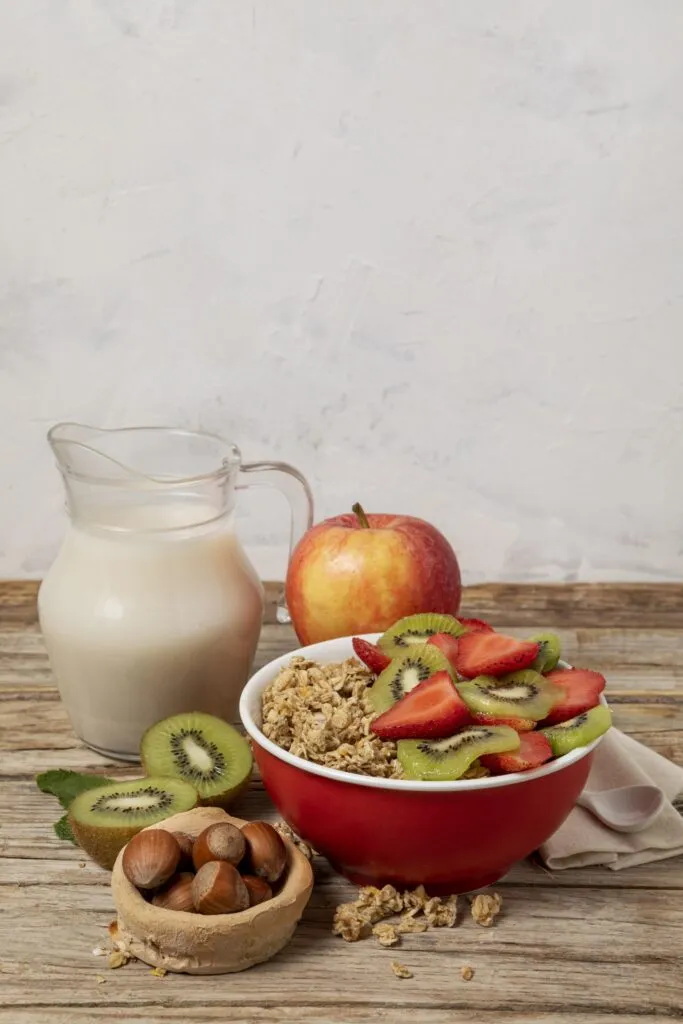 high angle selection breakfast cereals bowl with fruits copy space 1