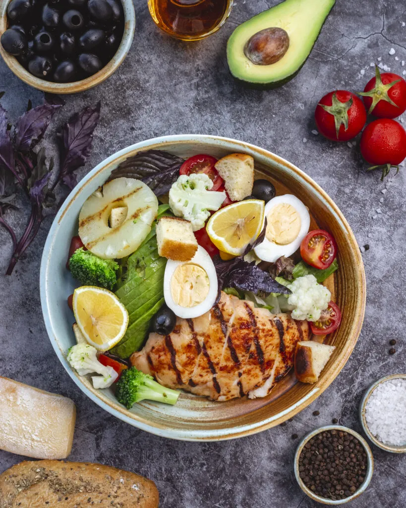 top view healthy diet salad with grilled chicken broccoli cauliflower tomato lettuce avocado lettuce 1