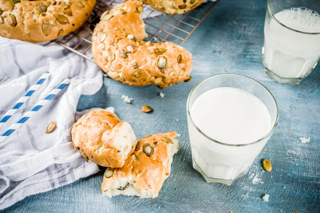healthy breakfast concept home made cereal bagels with milk glass