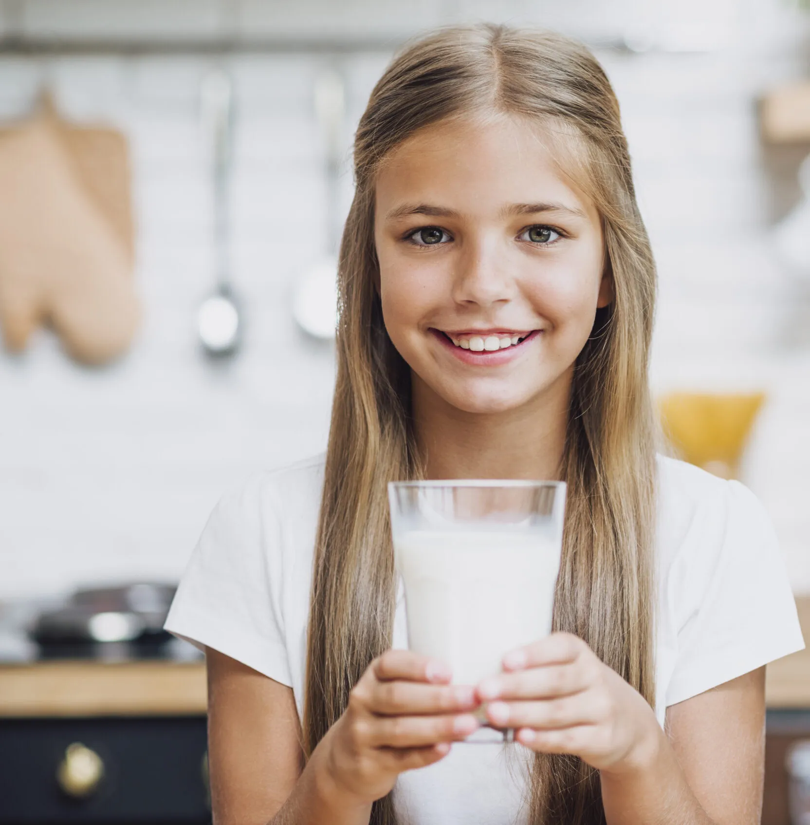 smiley girl holding glass milk scaled e1749198973175