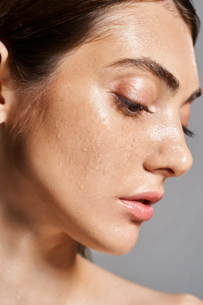 ethereal beauty woman embracing water drops face